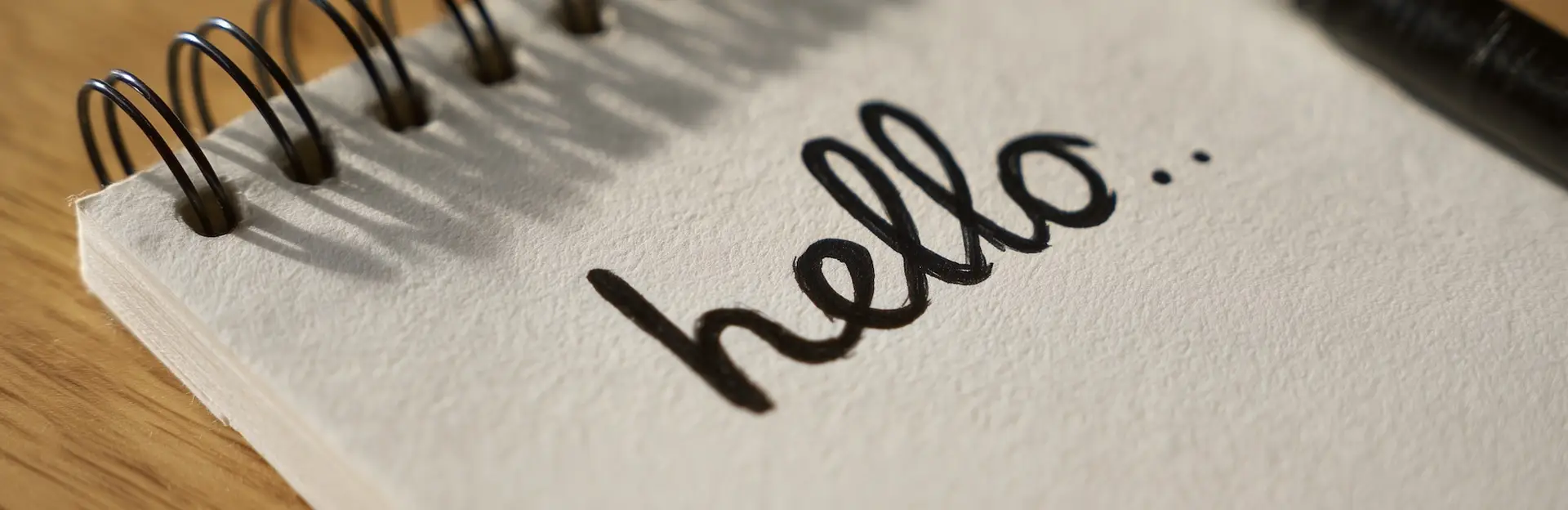 a notepad with hello written on it